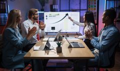 Asian woman showing financial report for colleagues