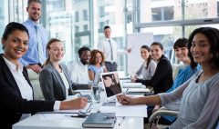 Portrait of happy businesspeople working in office