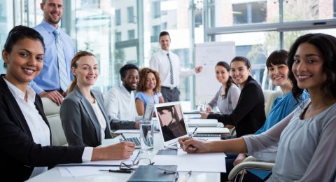 Portrait of happy businesspeople working in office