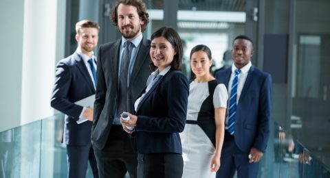 Portrait of confident businesspeople standing in office