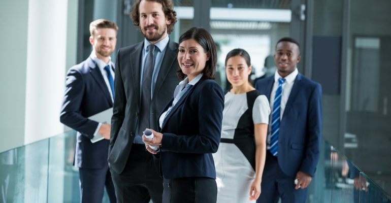 Portrait of confident businesspeople standing in office