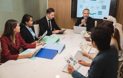 diverse business team leader discuss financial paperwork, Smart businessman and businesswoman