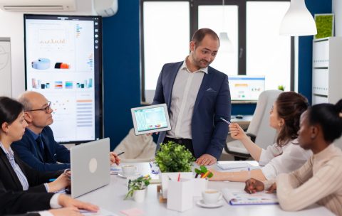 Employee asking executive questions during presentation