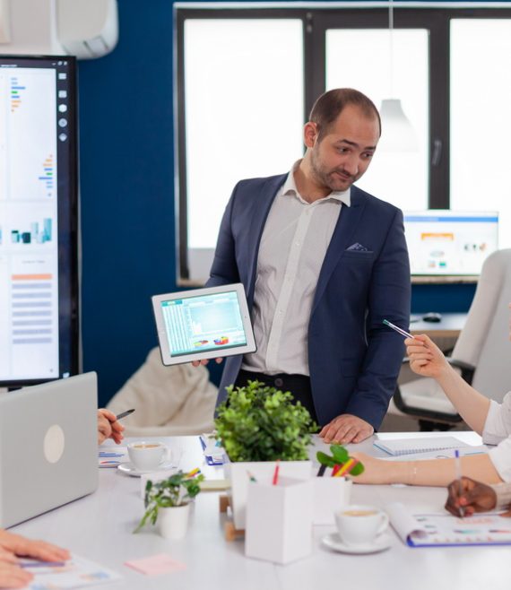 Employee asking executive questions during presentation