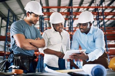 Shot of a group of builders having a meeting at a construction site.