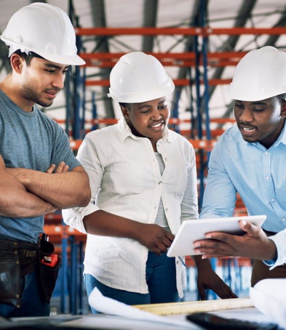 Shot of a group of builders having a meeting at a construction site.